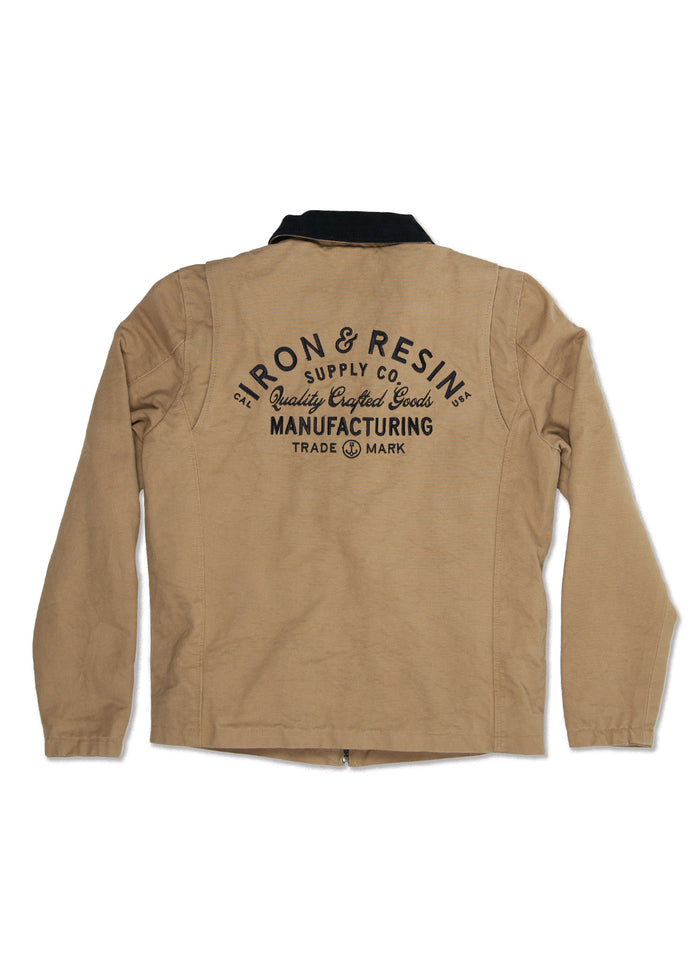 Tan jacket with "Iron & Resin Supply Co. Quality Crafted Goods Manufacturing" printed on the back in black text.