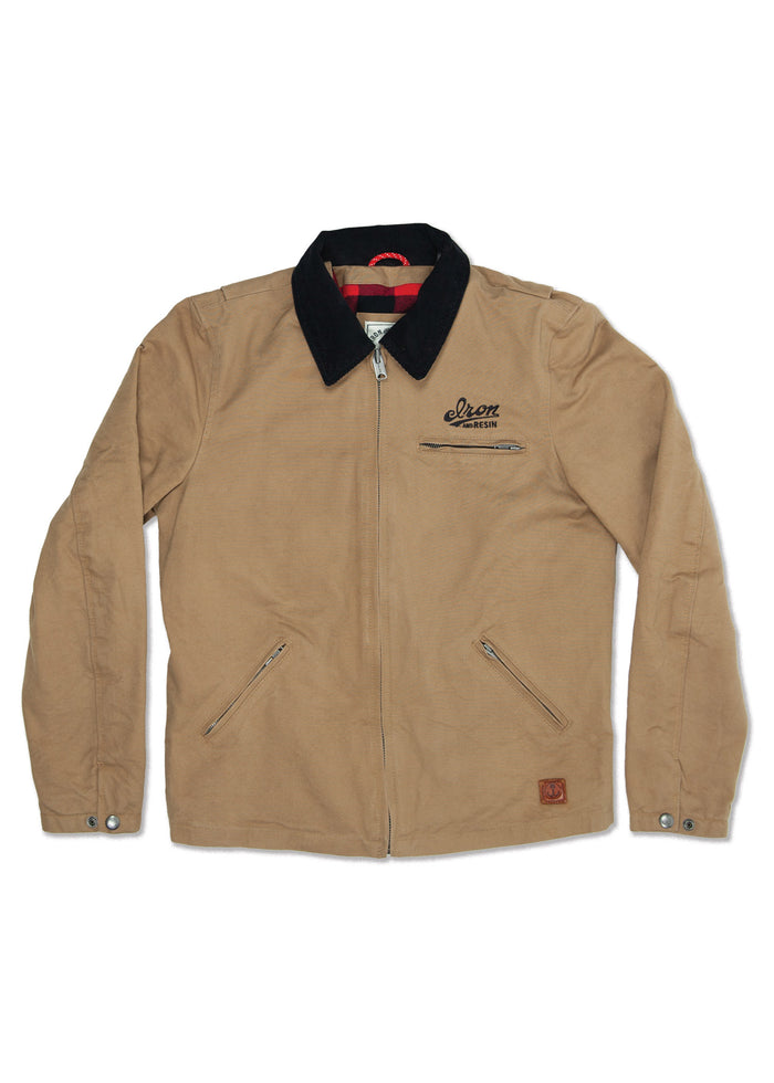 Tan jacket with black collar, zip front, and two zip pockets. "Iron and Resin" logo on chest. Red plaid lining visible inside.