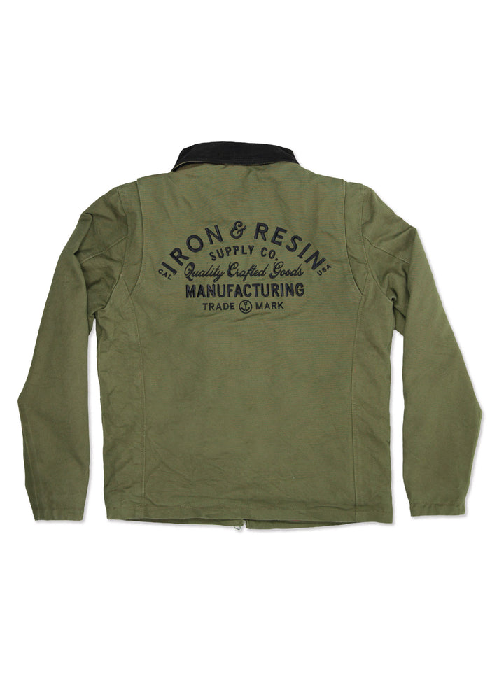 Olive green jacket with "Iron & Resin Supply Co." logo on back, highlighting quality crafted goods and manufacturing trademark.