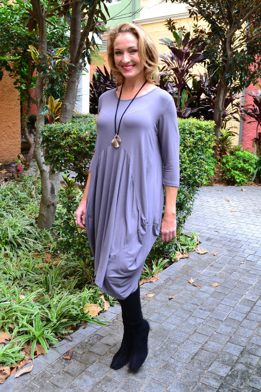 Soft grey Cali&Co Cocoon Sophia tunic dress displayed on a hanger with flowing fabric and relaxed fit.